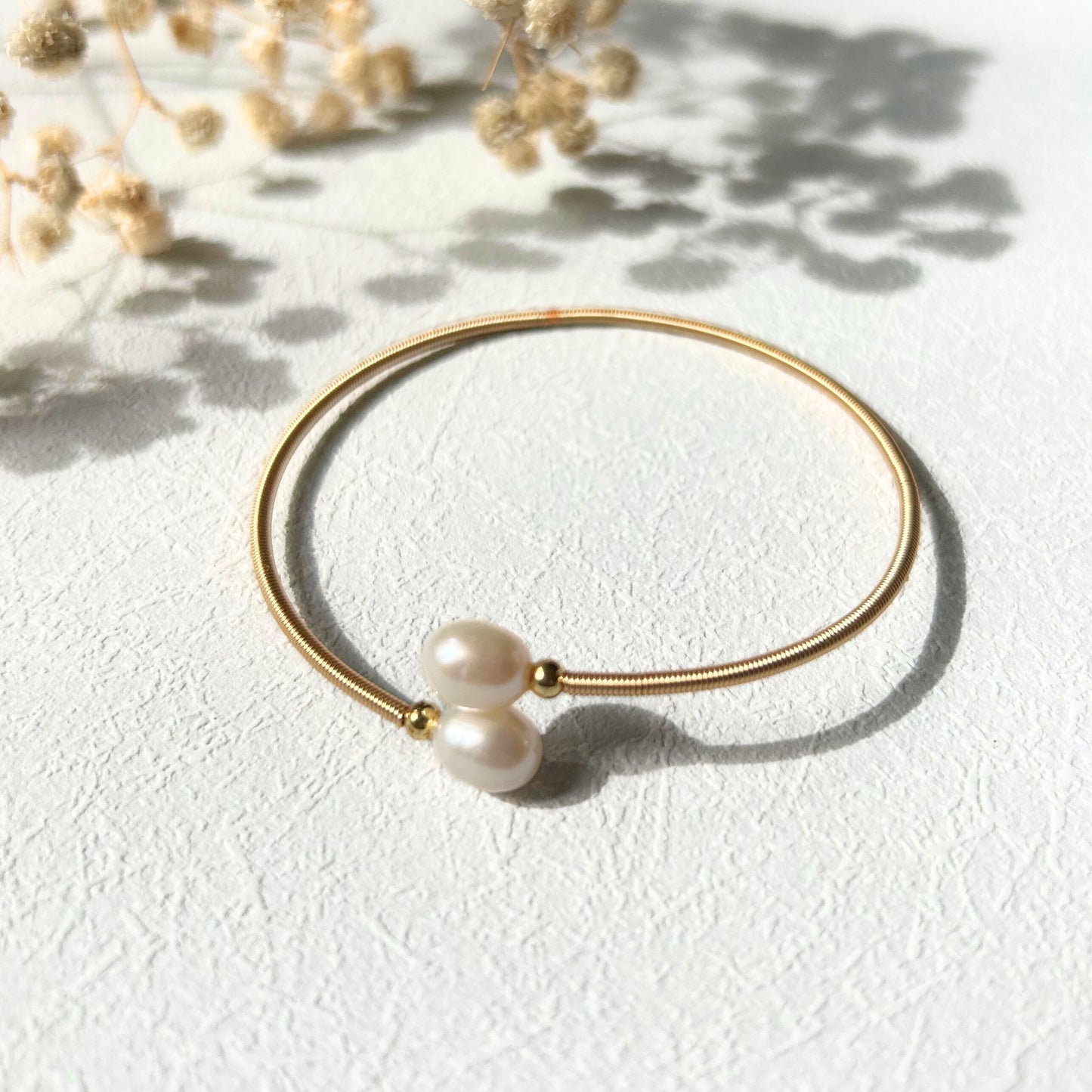 Two Pearls on a Bangle